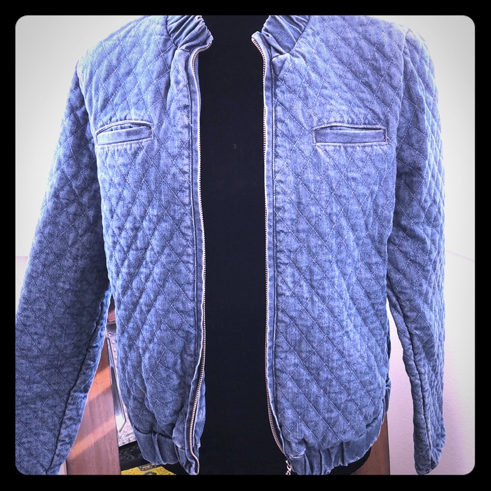 A denim bomber jacket, with quilting detail.